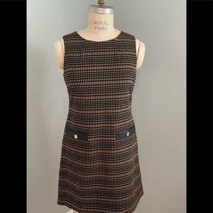 Easy dressing! Accentuate your best with this terrific dress! Wash and hang.